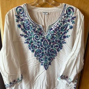 White with blue green embroidered top